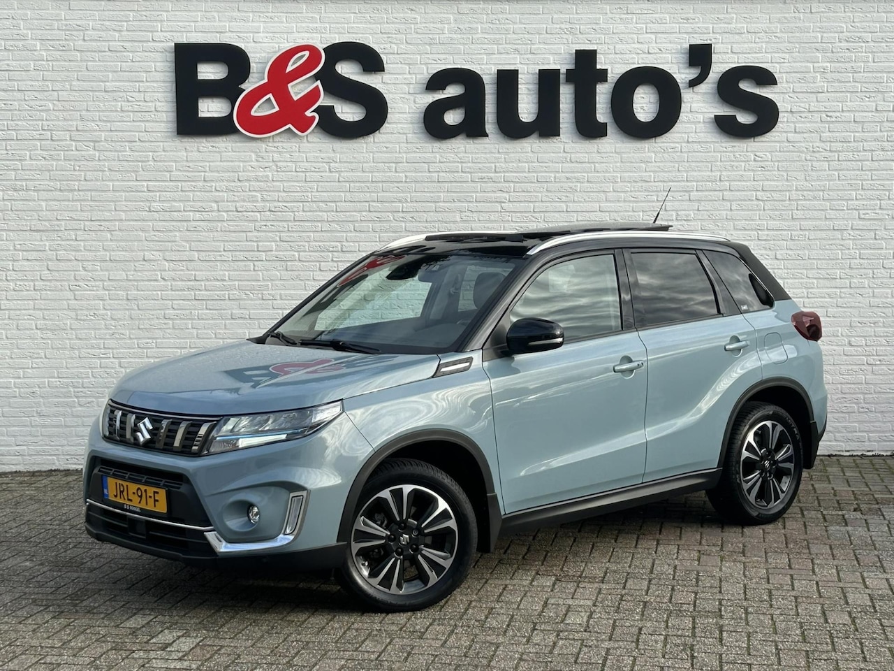 Suzuki Vitara - 1.5 Hybrid Automaat Panorama Led Camera Pdc Stoelverwarming Lane Assist Keyless - AutoWereld.nl