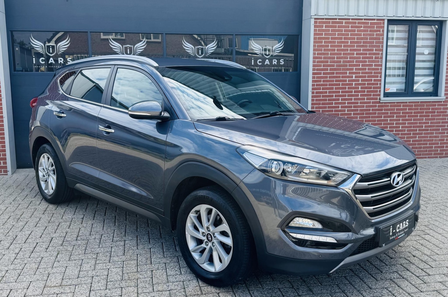 Hyundai Tucson - 1.6 GDi LEER/NAVI/CAMERA Dealer onderhouden - AutoWereld.nl