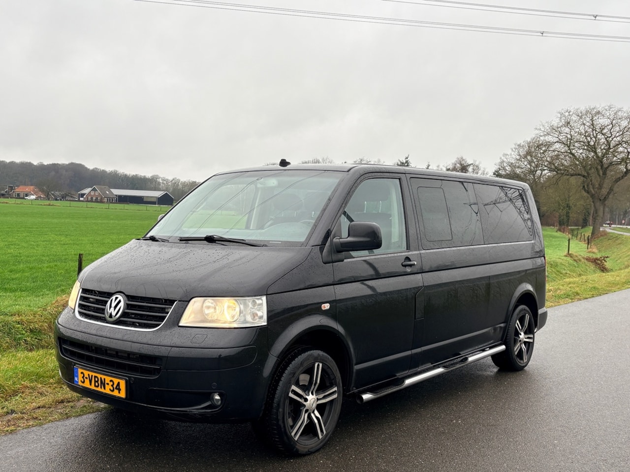 Volkswagen Transporter - 2.5 TDI 340 Trendline DC Caravelle 6-persoons, Navi, Cruise, ECC, Trekhaak, 18" - AutoWereld.nl
