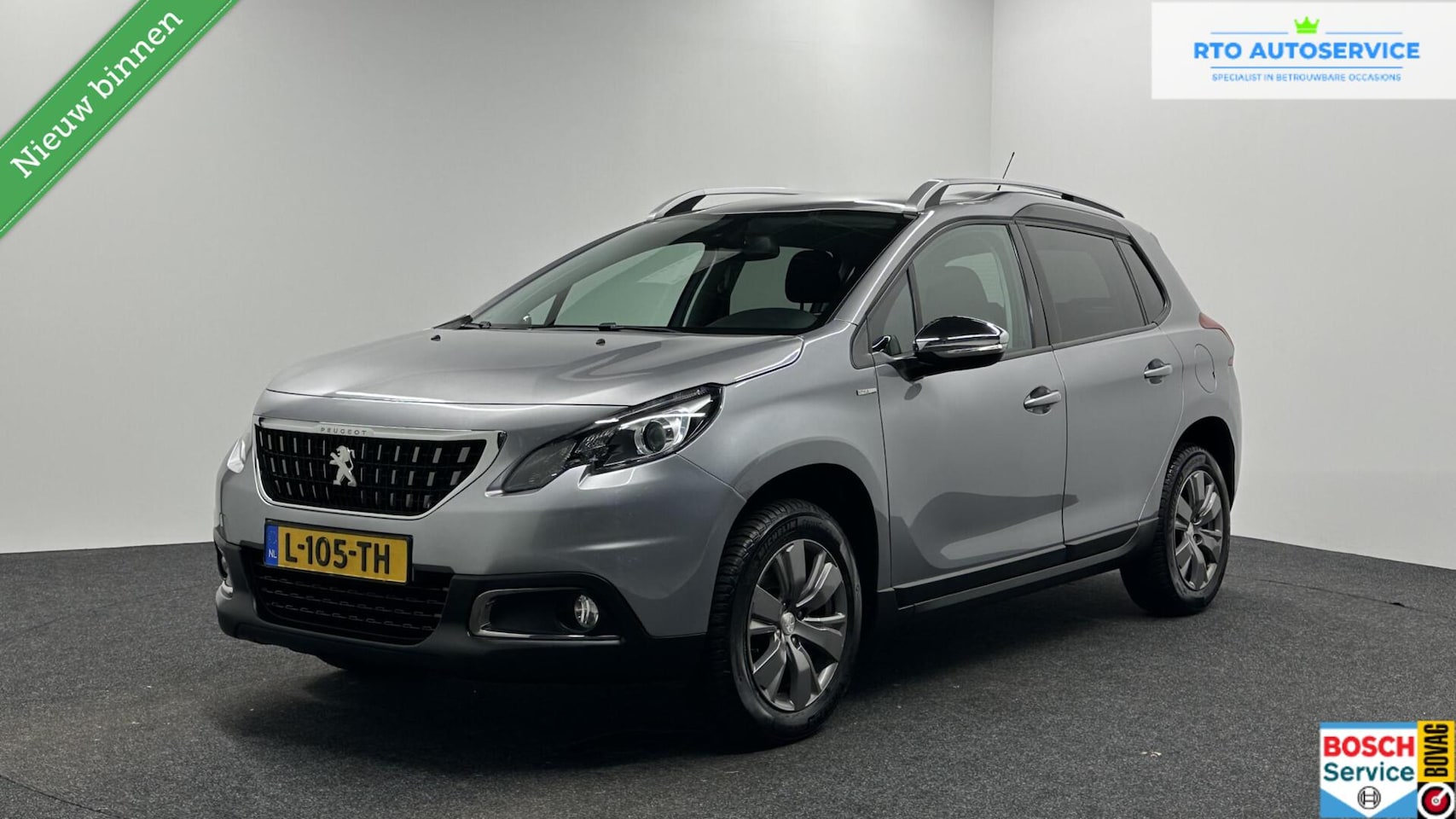 Peugeot 2008 - 1.2 PureTech Allure Pack CAMERA ECC CRUISE LM NAVI CARPLAY. - AutoWereld.nl