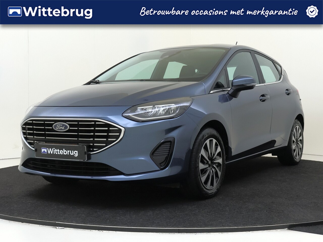 Ford Fiesta - 1.0 EcoBoost Hybrid Titanium | Keyless Entry | Parkeerhulp | Carplay | *WINTERPACK* - AutoWereld.nl