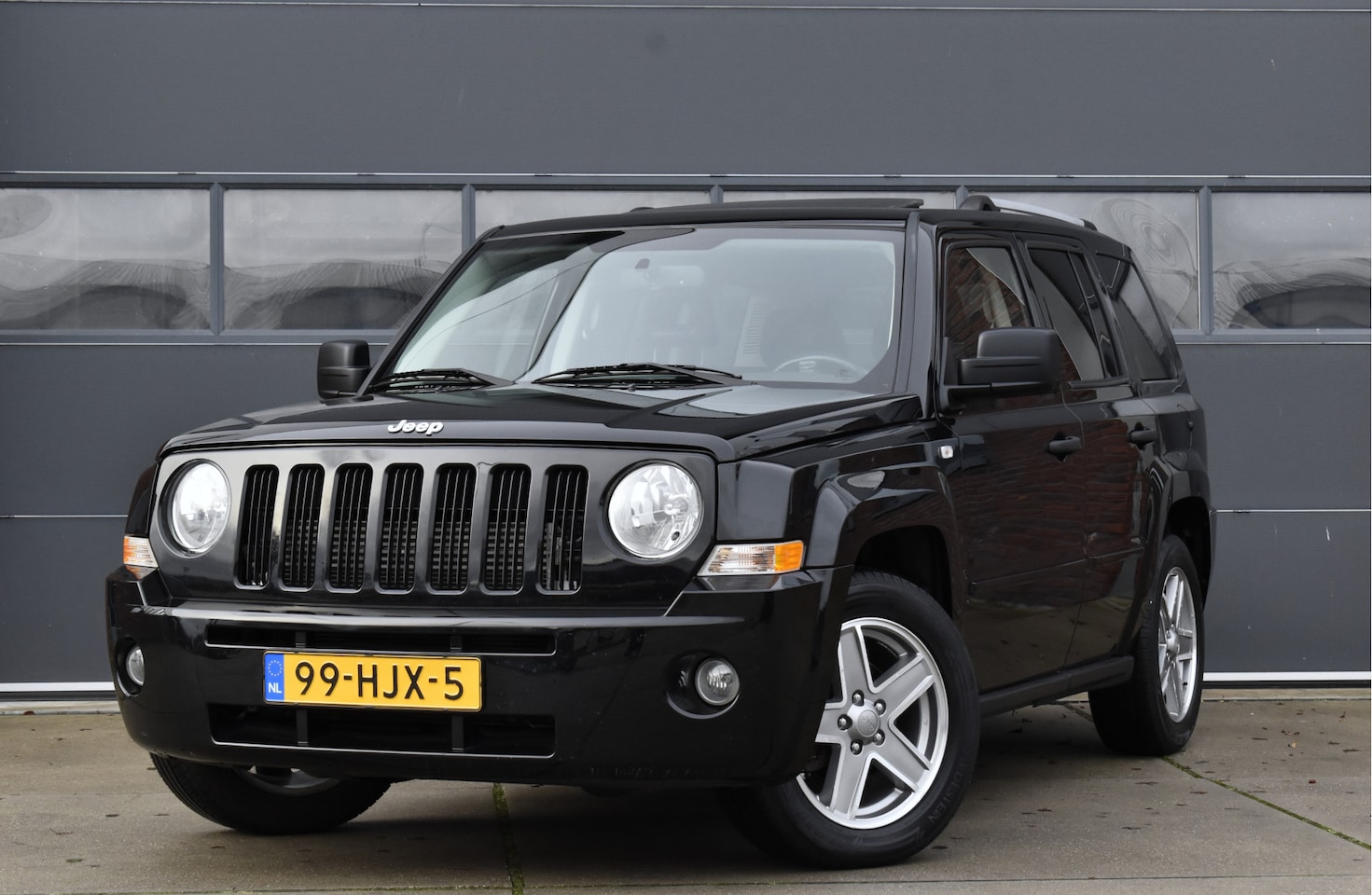 Jeep Patriot - 2.4 Limited Schuifdak - Trekhaak - Cruise - AutoWereld.nl