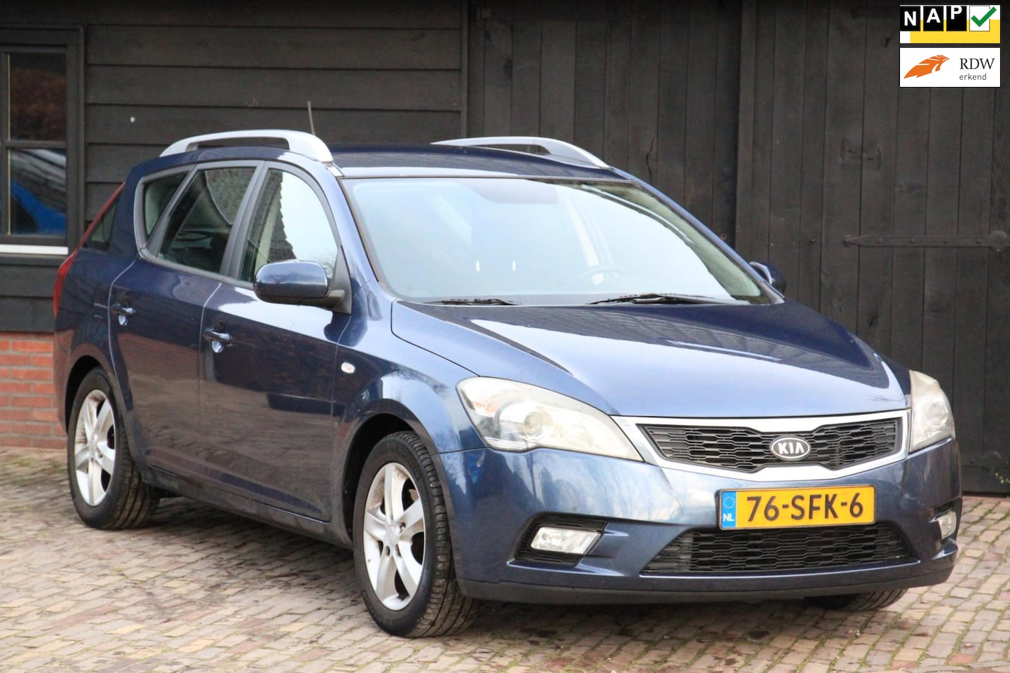 Kia Cee'd Sporty Wagon - 1.4 CVVT Navigator Plus Pack Navigatie/Camera/Airco/Trekhaak - AutoWereld.nl