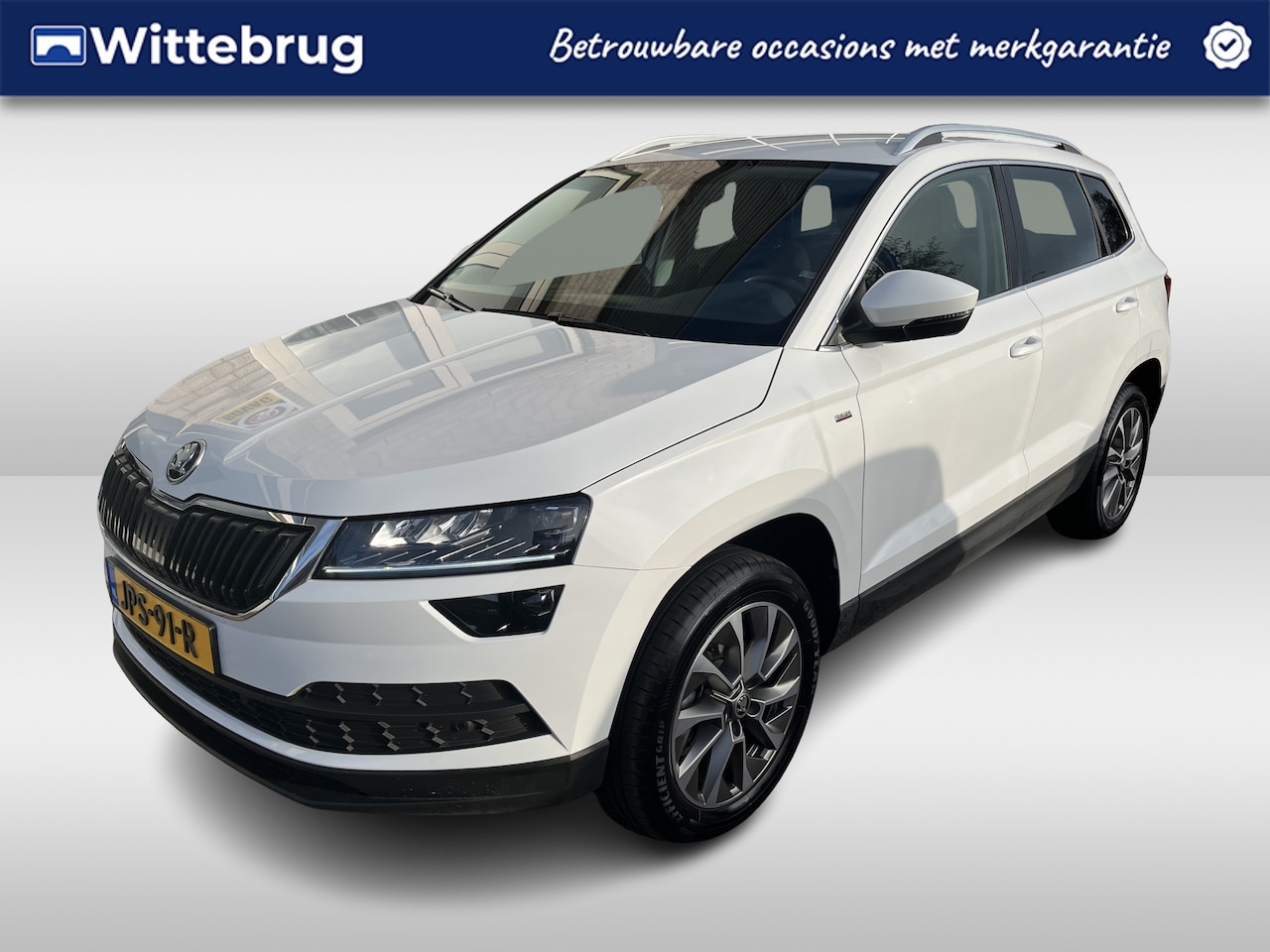 Skoda Karoq - 1.0 TSI Ambition / CRUISE/ SMARTLINK/ PARK. SENSOREN + CAMERA/ CLIMA/ STOEL VERWARM./ BLUE - AutoWereld.nl