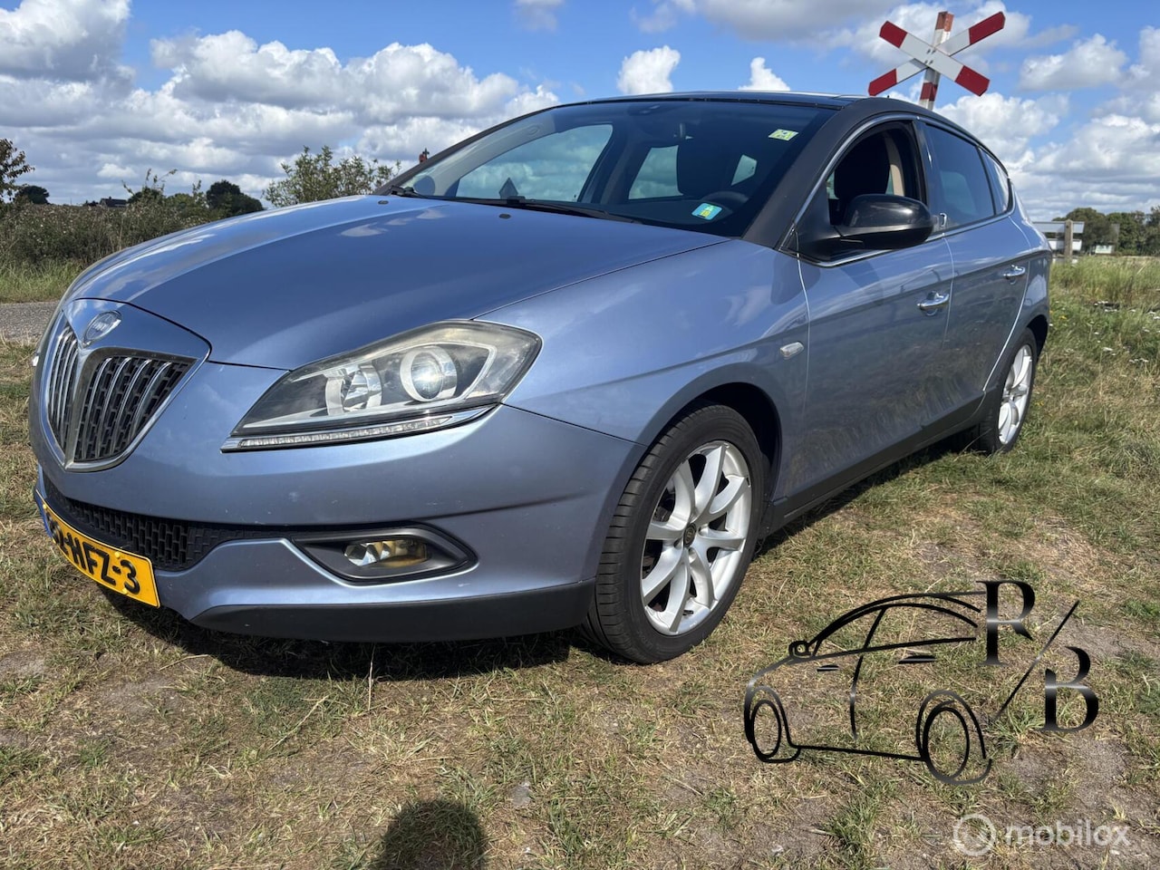 Lancia Delta - 1.4-16V Platino AIRCO CRUISE PANORAMA NIEUWE APK - AutoWereld.nl