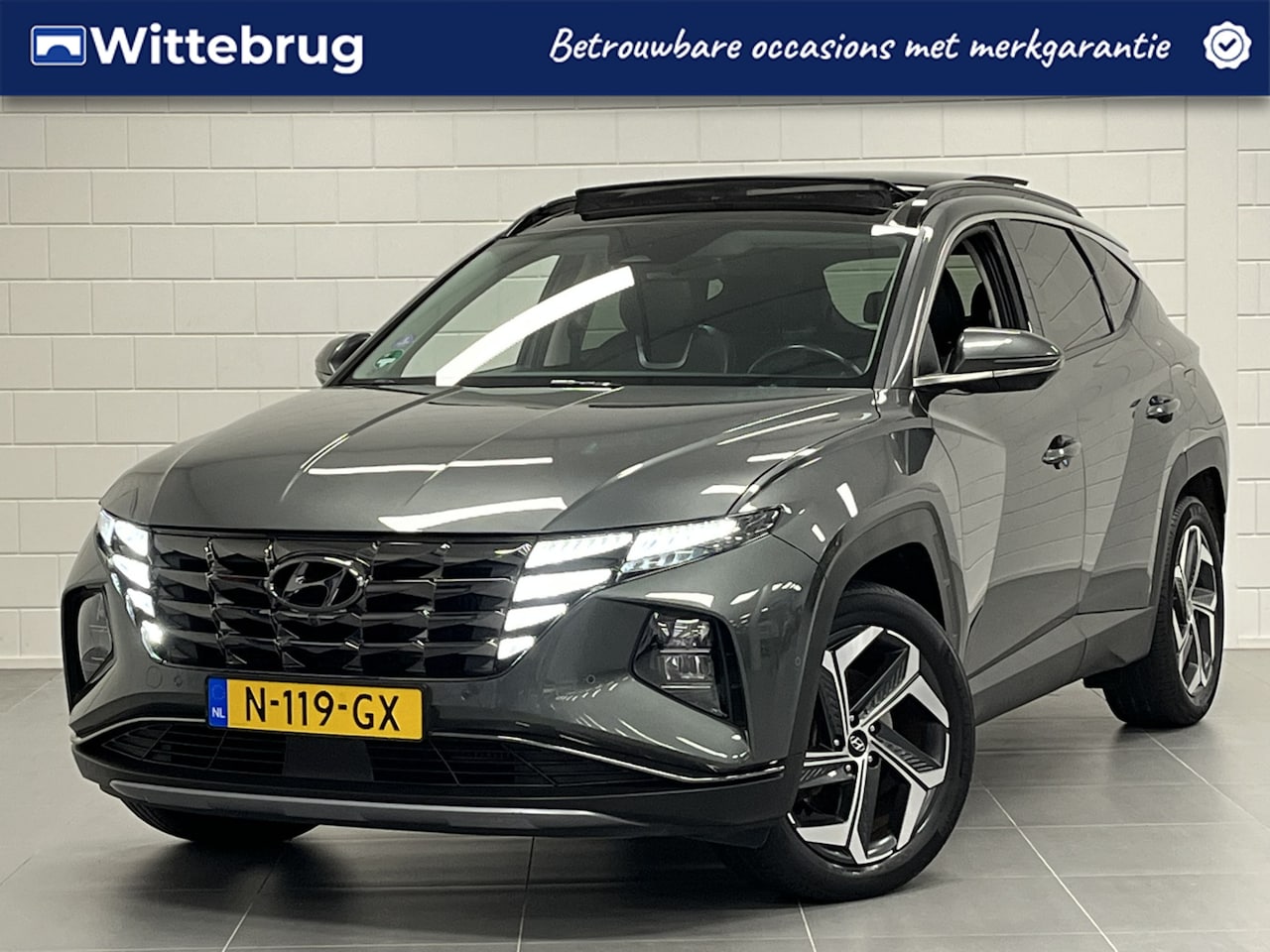 Hyundai Tucson - 1.6 T-GDI HEV Premium Sky TREKHAAK 1650 KG TREKGEWICHT! | PANORAMADAK | LEDER | BOMVOL OPT - AutoWereld.nl