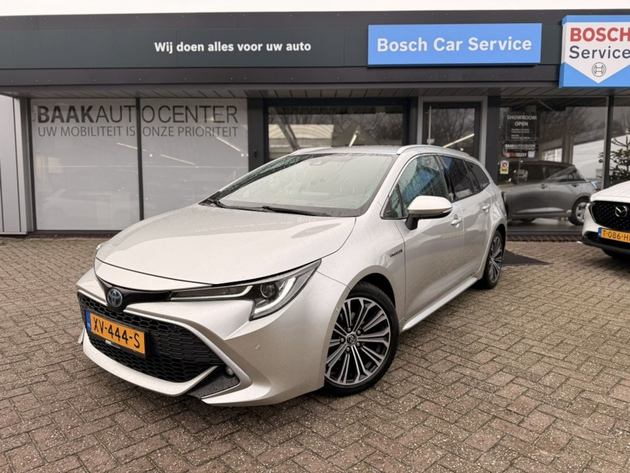 Toyota Corolla Touring Sports - 1.8 Hybrid Executive | Camera | Sensoren | Alcantara - AutoWereld.nl