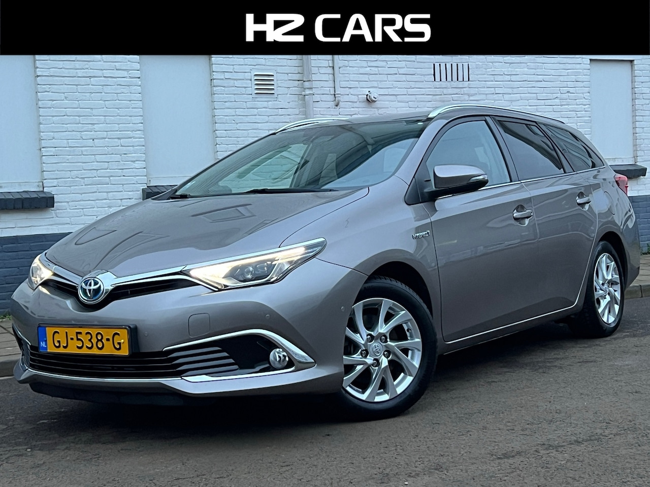 Toyota Auris Touring Sports - 1.8 Hybrid Lease Exclusive|Leder|Camera|Navi|PDC - AutoWereld.nl