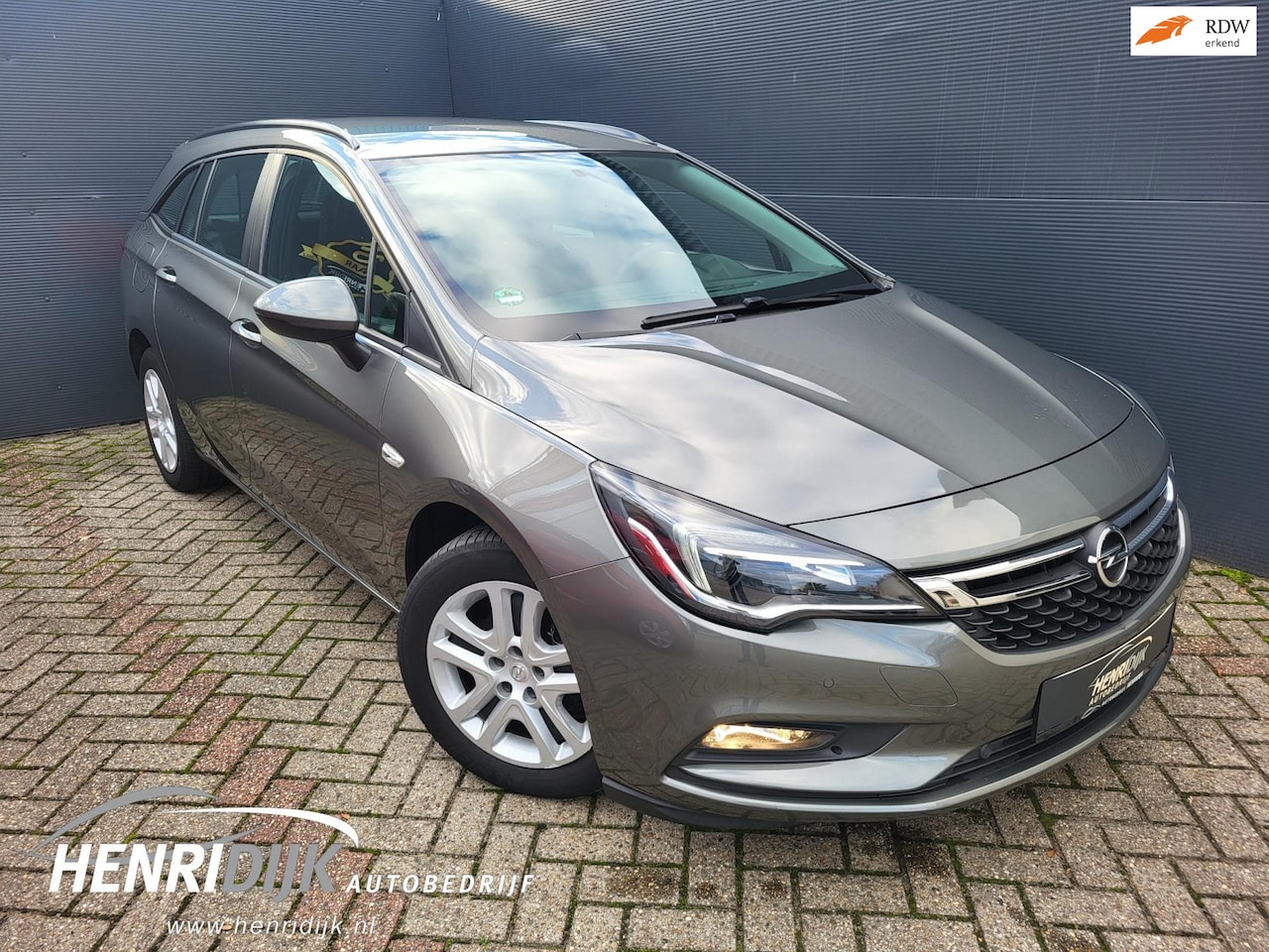Opel Astra Sports Tourer - 1.4 Edition Camera / Cruise / DAB / AC / PDC - AutoWereld.nl