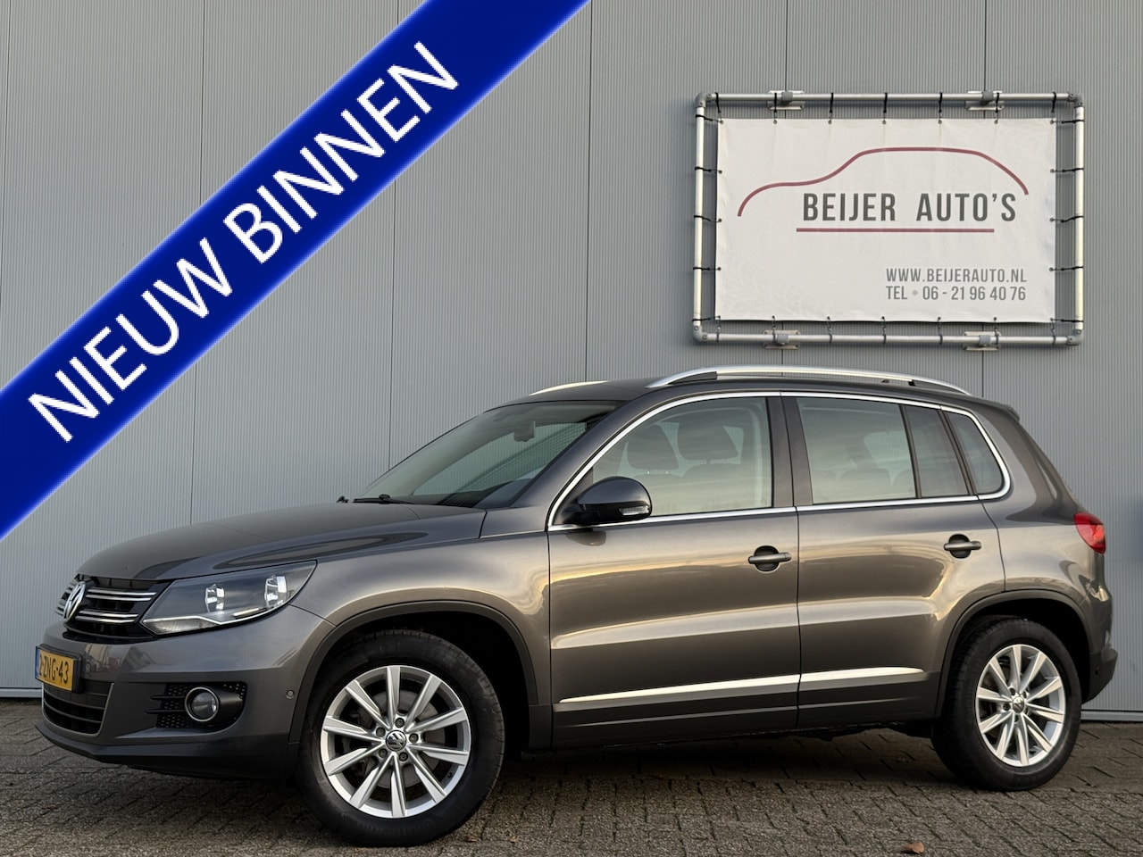 Volkswagen Tiguan - 1.4 TSI Sport&Style Navigatie/Trekhaak/PDC. - AutoWereld.nl