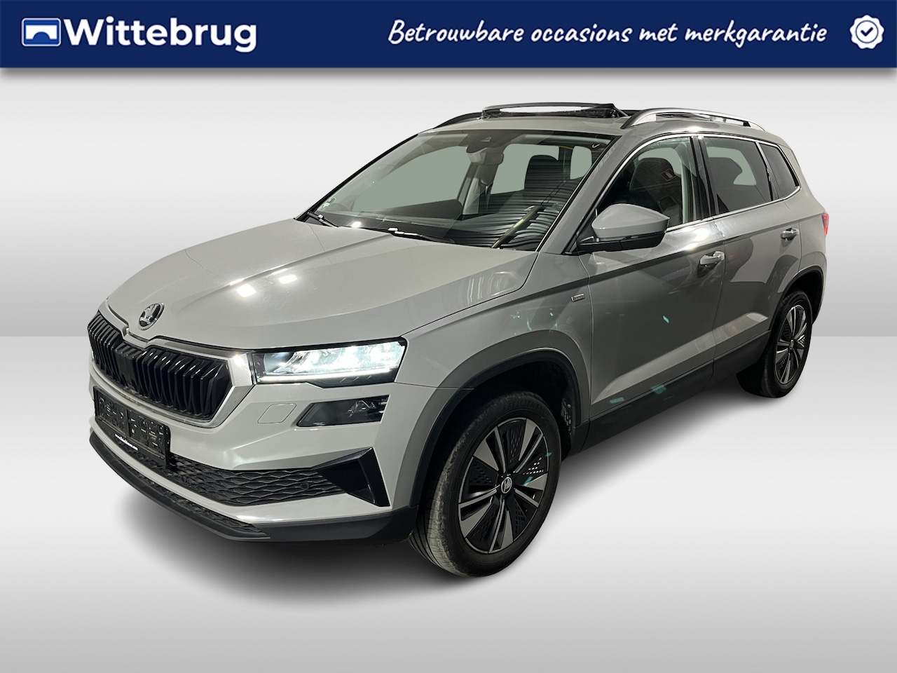 Skoda Karoq - 1.0 TSI Ambition / PANO/ STUUR+STOEL VERWARMING/ PARK.SENSOREN V+A/ CAMERA/ ACC/ SMARTLINK - AutoWereld.nl
