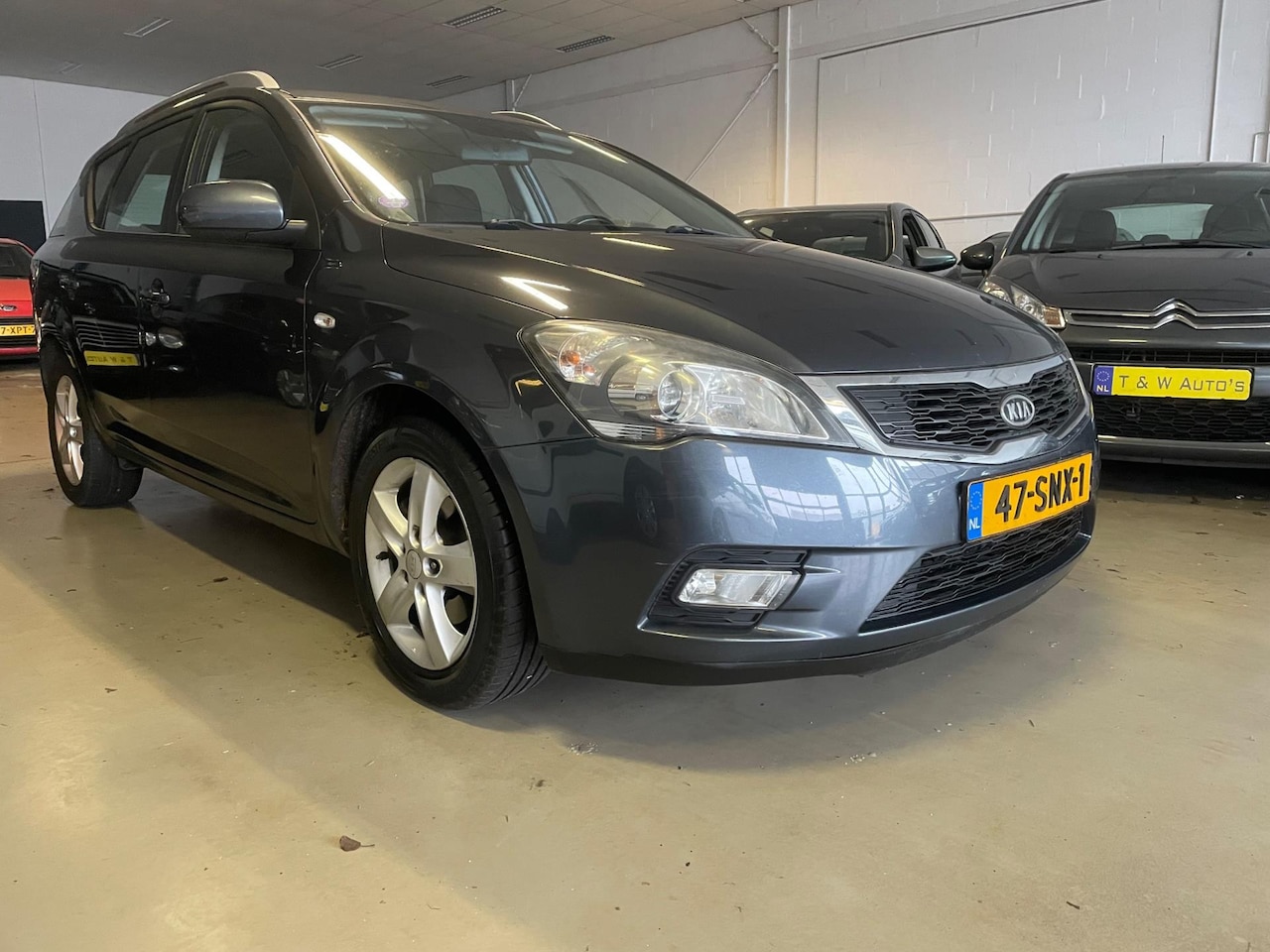 Kia Cee'd Sporty Wagon - 1.4 CVVT Navigator Plus Pack navi - AutoWereld.nl