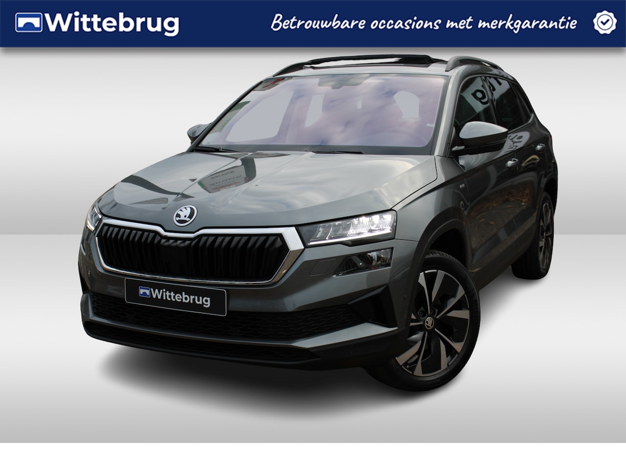 Skoda Karoq - 1.5 TSI ACT 150pk Ambition DSG Automaat / Navigatie / Panorama dak / LM 18 inch / Parkeers - AutoWereld.nl