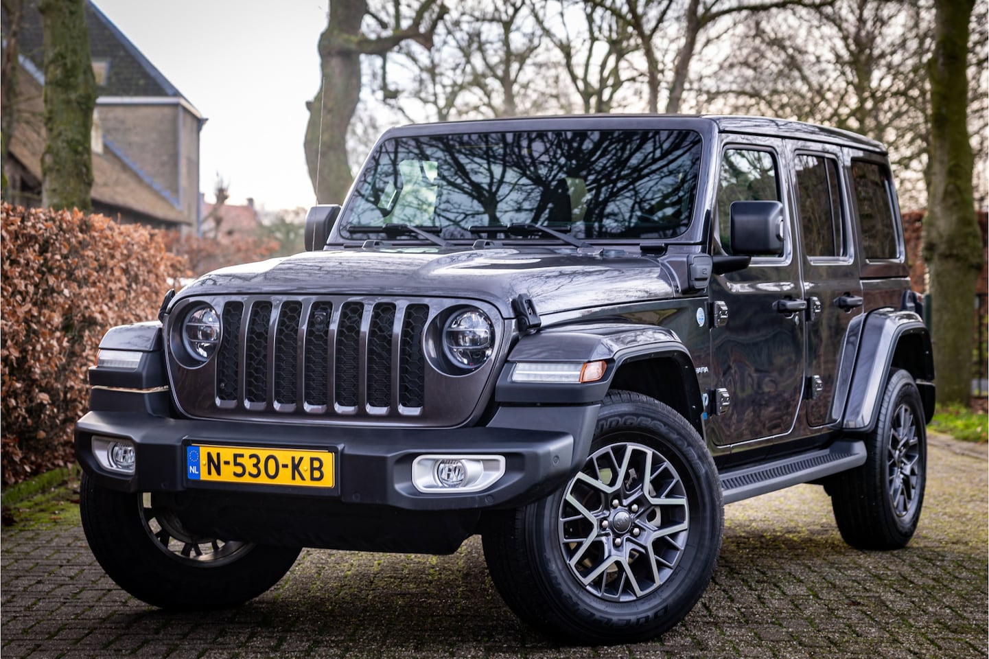Jeep Wrangler Unlimited - 4xe 380 Sahara Sky One Softtop Adaptive Cruise Trekhaak - AutoWereld.nl