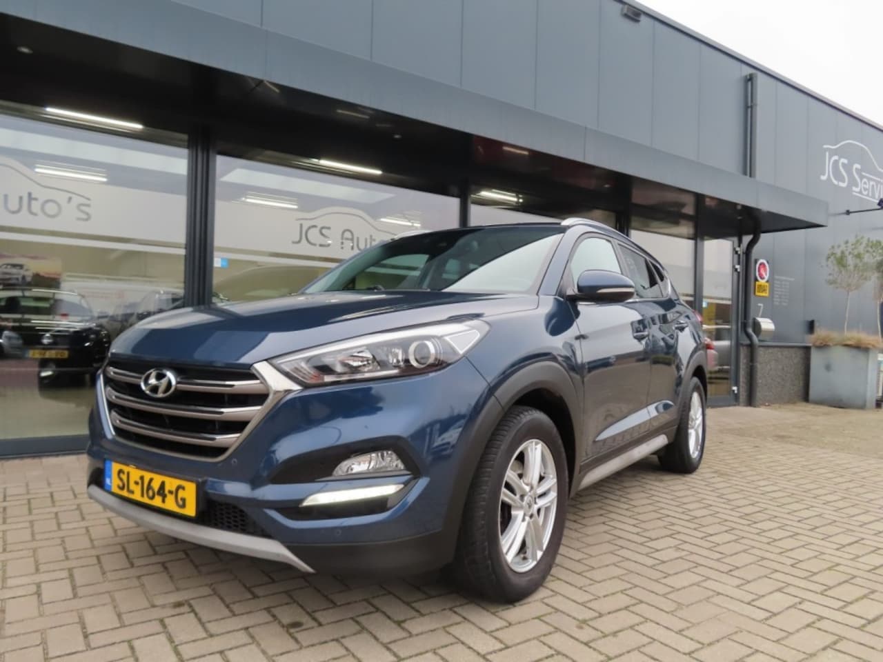 Hyundai Tucson - 1.7 CRDI GO! Ecc Navi Pdc Trekhaak 2018 - AutoWereld.nl
