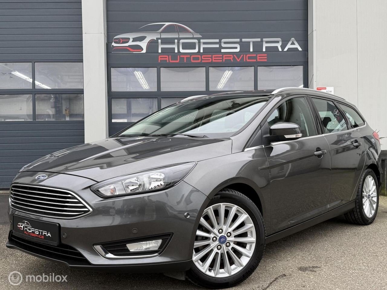 Ford Focus Wagon - 1.0 Titanium Edition Trekhk Clima Navi Nap - AutoWereld.nl