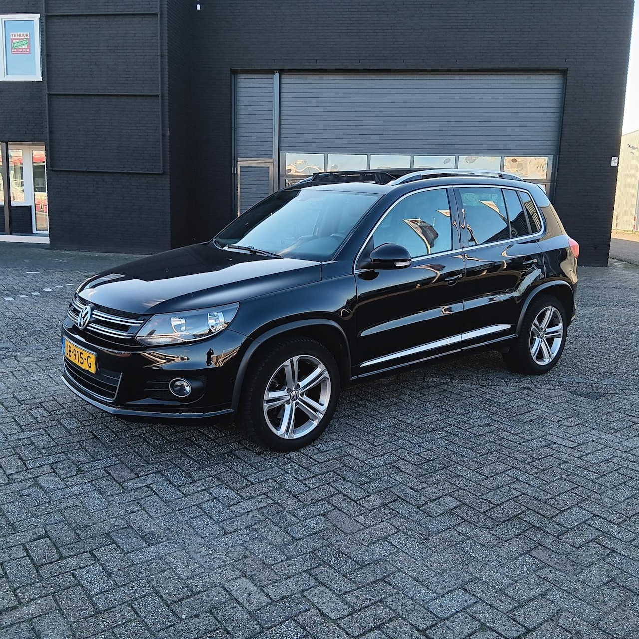 Volkswagen Tiguan - 1.4 TSI Sport&Style - AutoWereld.nl