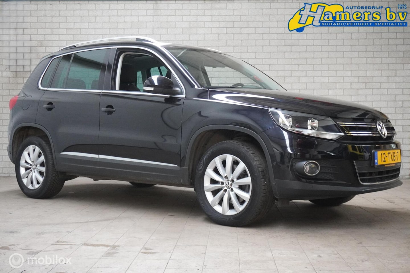 Volkswagen Tiguan - 1.4 TSI Sport&Style - AutoWereld.nl