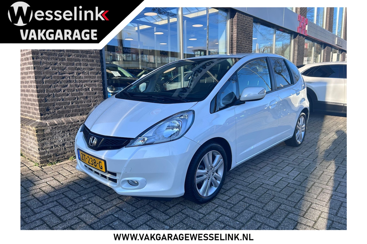 Honda Jazz - 1.4 Elegance | all season banden - AutoWereld.nl