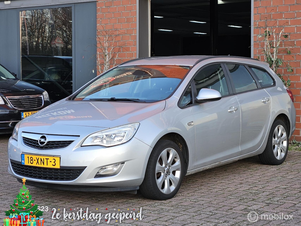 Opel Astra Sports Tourer - 1.4 Cosmo navi clima cruise controle - AutoWereld.nl