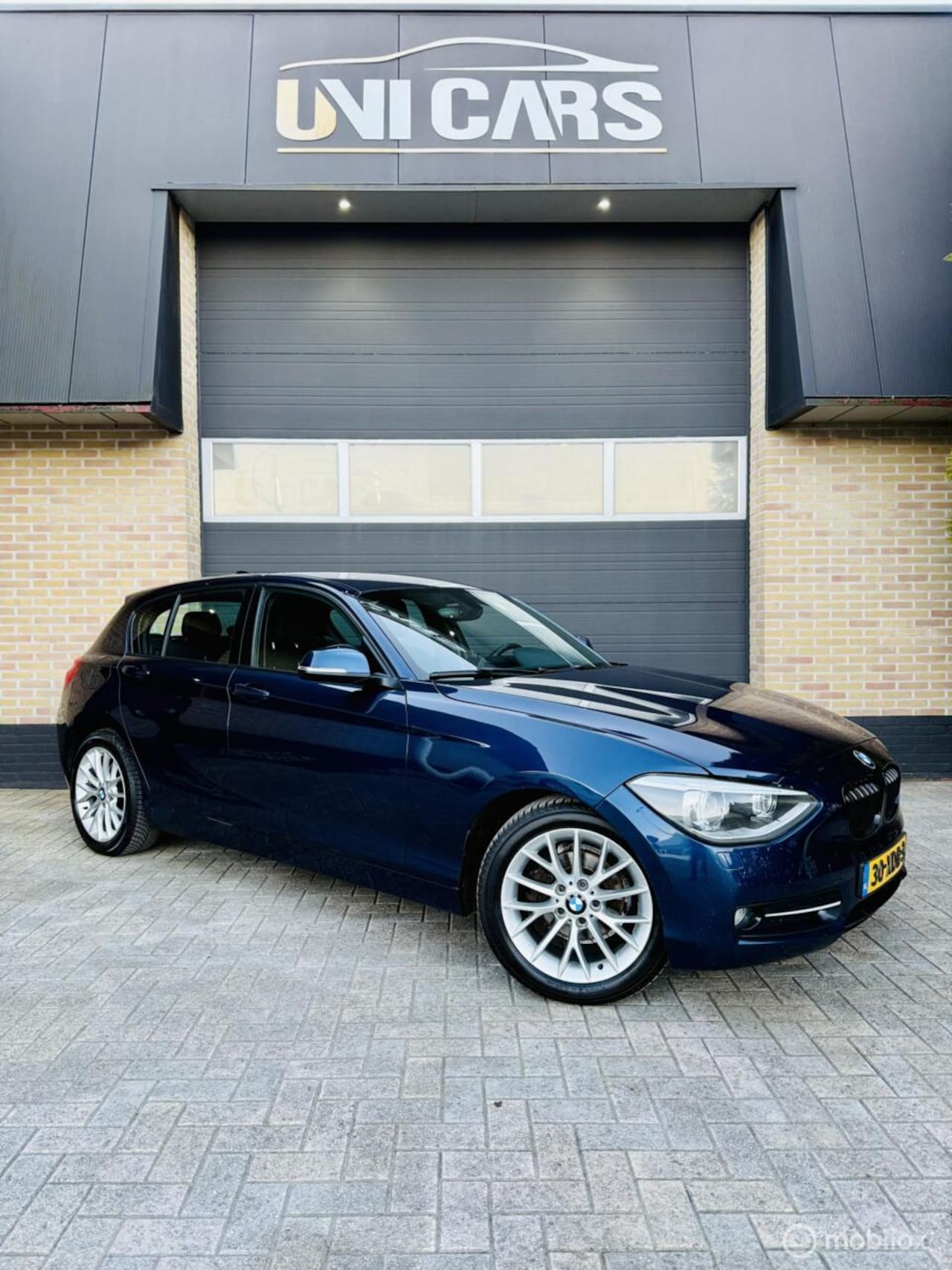 BMW 1-serie - 116i Business+|Apple CarPlay|clima|Cruis|New APK - AutoWereld.nl