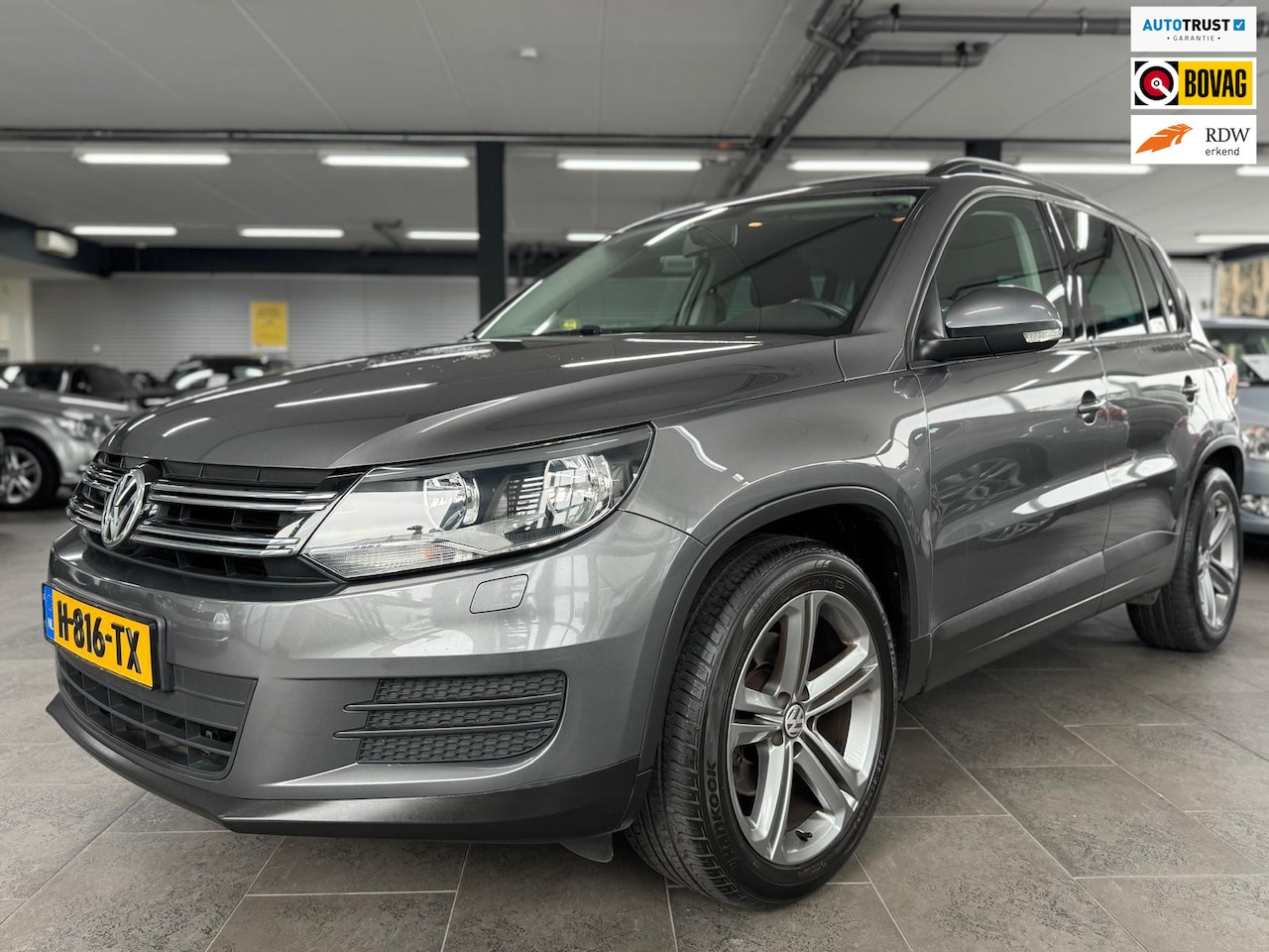 Volkswagen Tiguan - 1.4 TSI Sport&Style navi clima cruise controle lm-velgen parkeersensoren stoelverwarming t - AutoWereld.nl