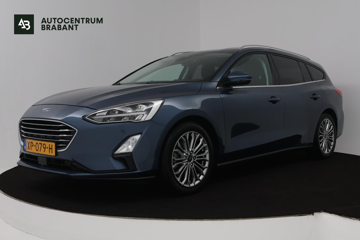 Ford Focus Wagon - 1.0 EcoBoost Titanium Business (NAVIGATIE, STUUR-/STOELVERWARMING, 1e EIGENAAR, GOED ONDER - AutoWereld.nl
