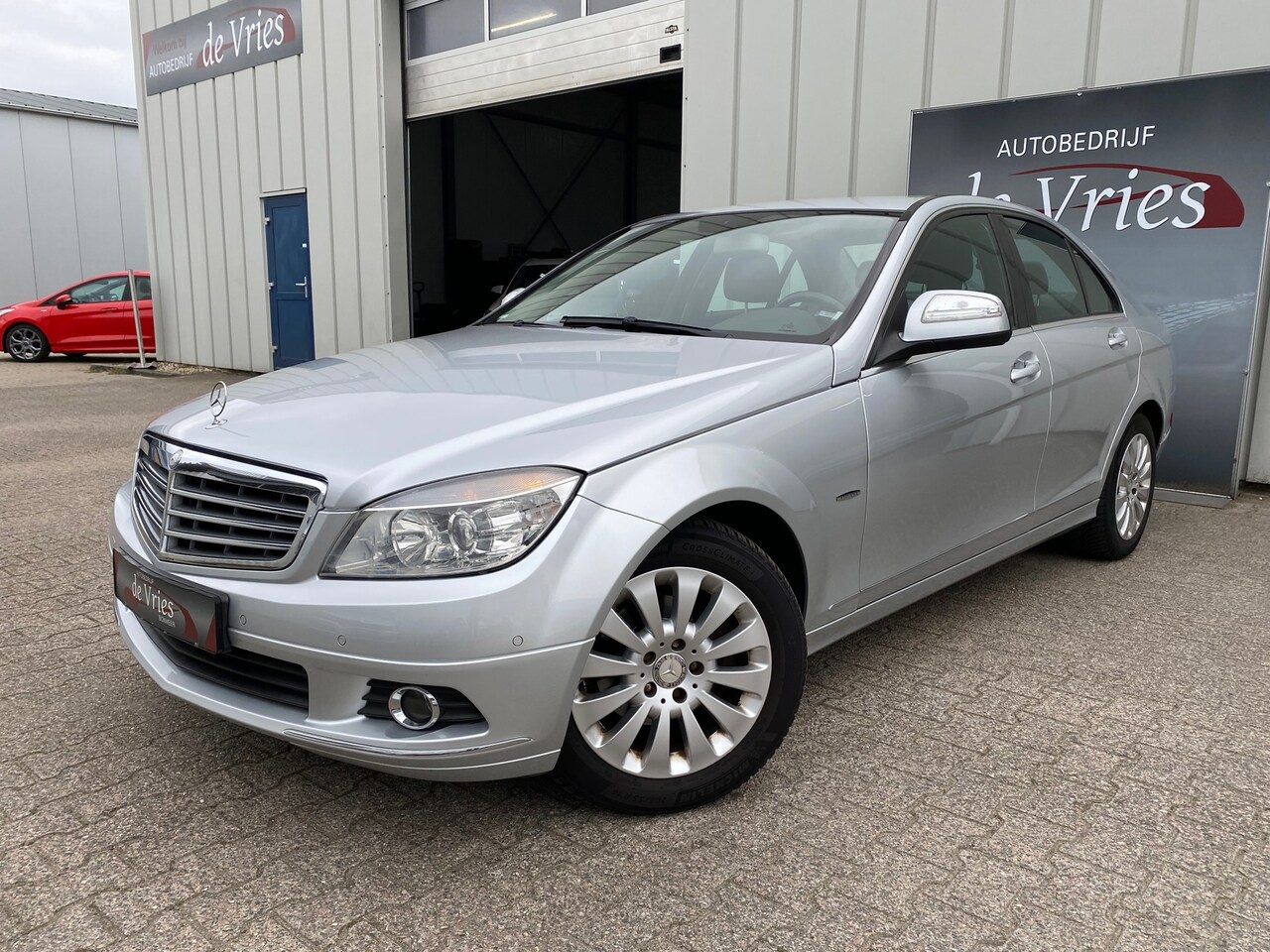 Mercedes-Benz C-klasse - 180 K Elegance Automaat / Clima / Cruise / Navi / Trekhaak / PDC - AutoWereld.nl