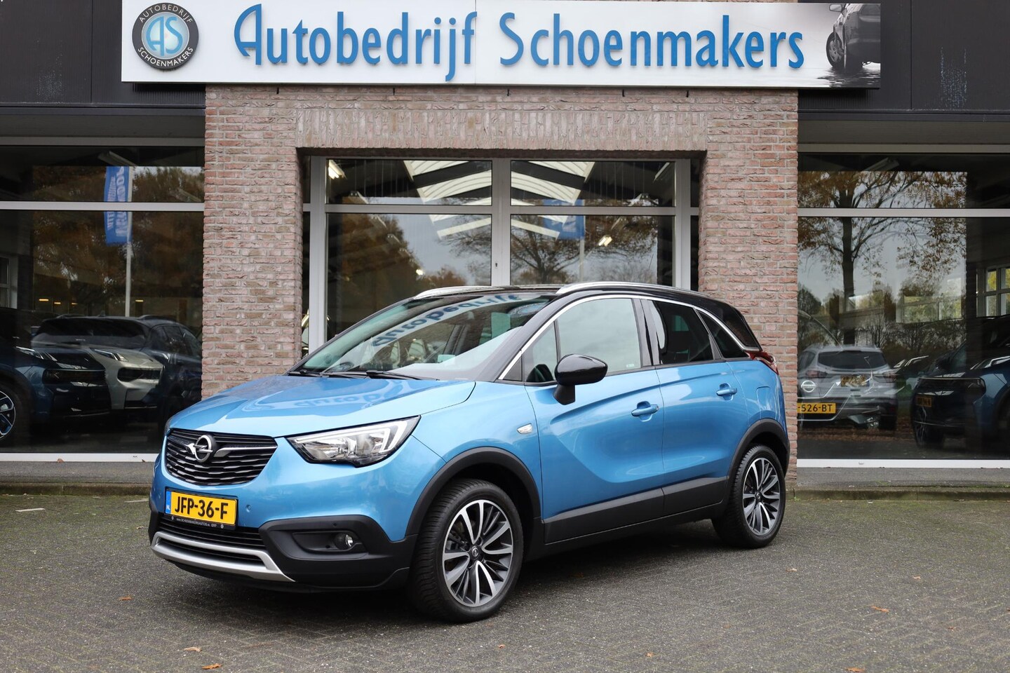Opel Crossland X - 1.2 Turbo Online Edition HALF-LEER TREKHAAK CARPLAY HUD CRUISE CLIMA NAVI LANE-ASSIST PDC - AutoWereld.nl