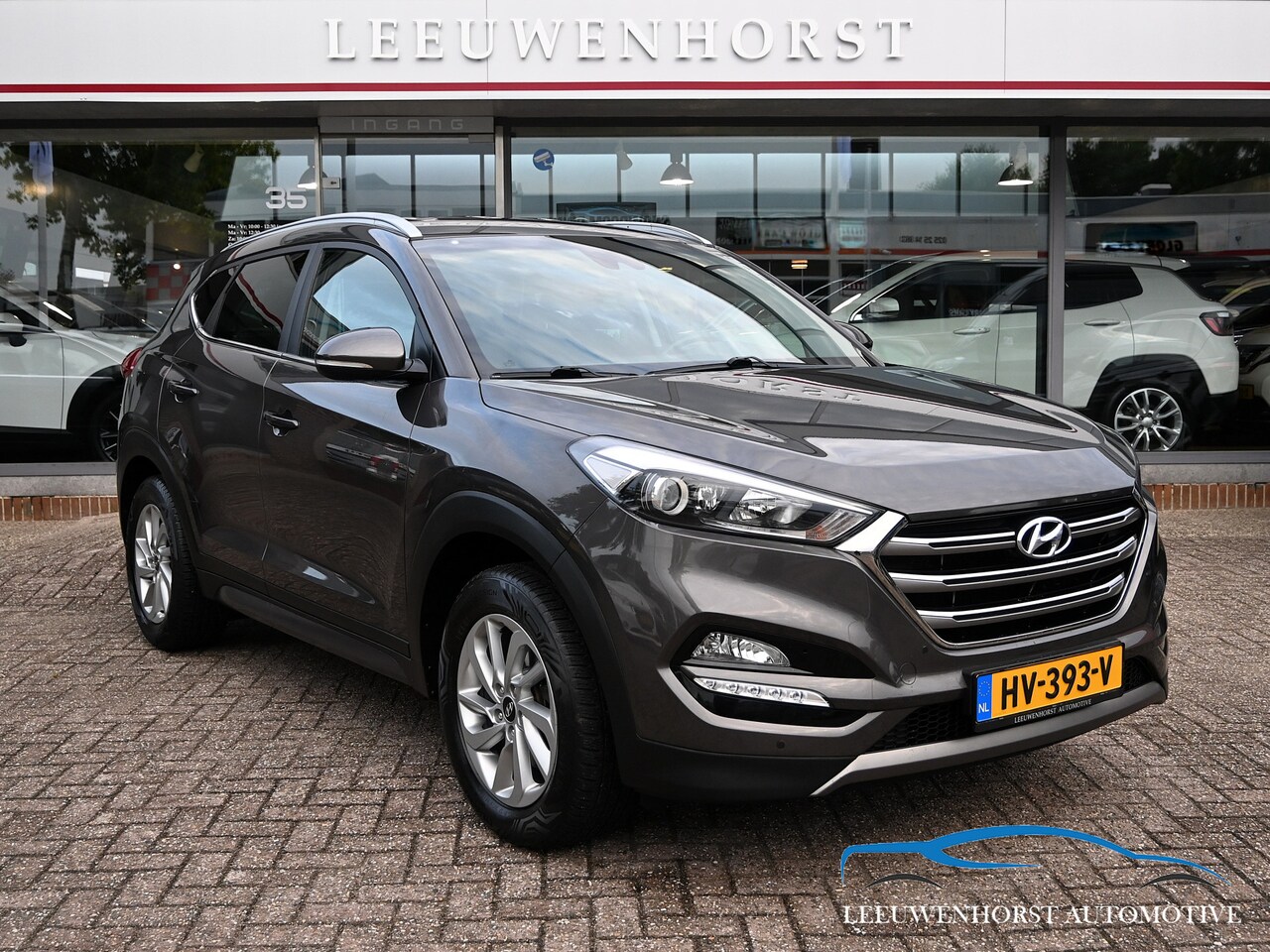 Hyundai Tucson - 1.6 GDi Comfort camera, clima, cruise, navi, trekhaak, NL-dealerauto - AutoWereld.nl