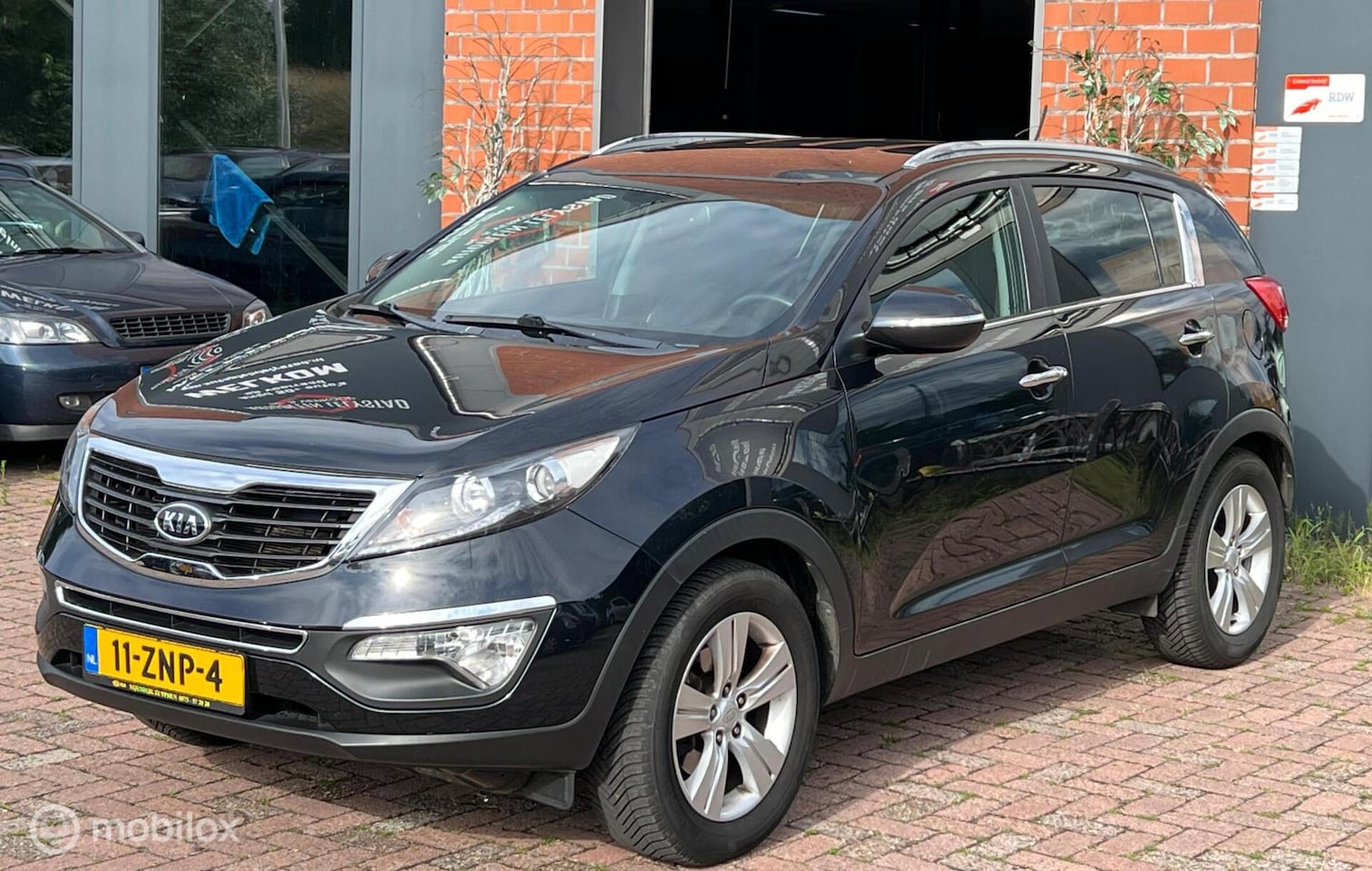 Kia Sportage - 1.6 GDI Plus Pack Airco cruise controle elek. Ramen - AutoWereld.nl