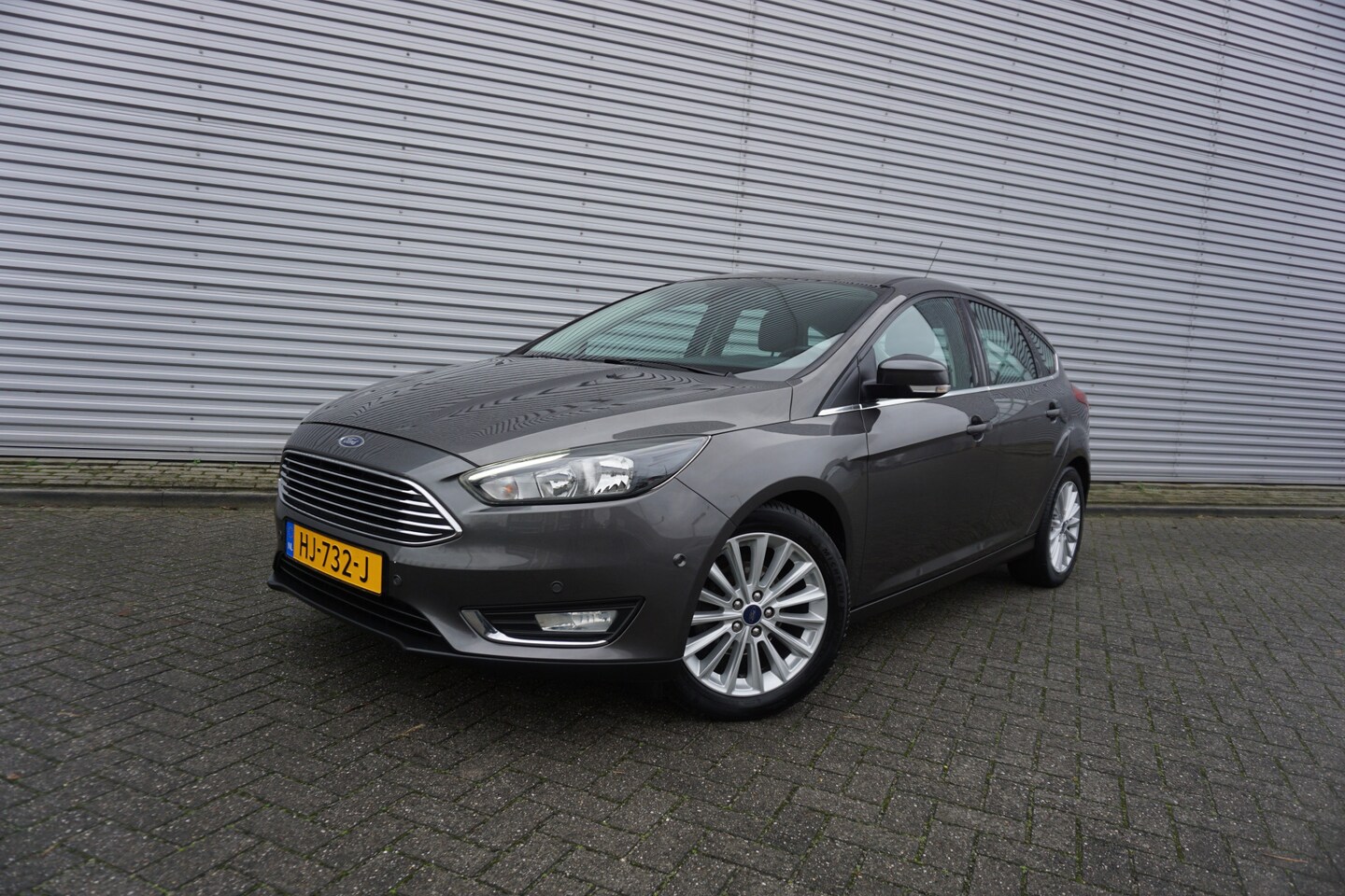 Ford Focus - 1.0 Titanium Edition 1e Eigenaar / Navi / Climate controle / Cruise / Lm velgen - AutoWereld.nl