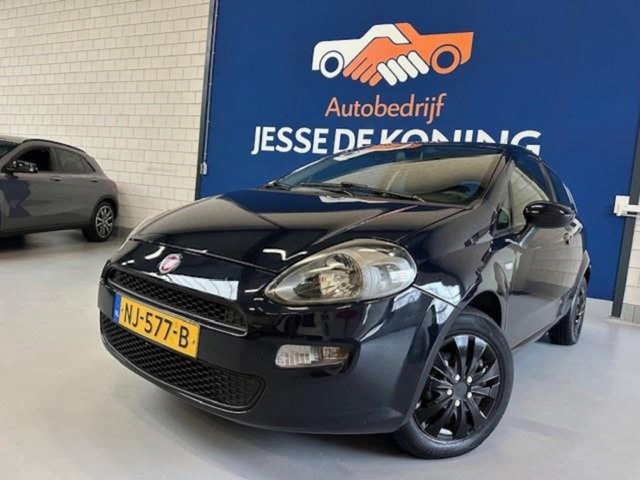 Fiat Punto Evo - 1.2 Pop /bj.2013 / kleur: blauw / airco / scherm / navigatie/ NAP met 152343 km.en APK tot - AutoWereld.nl