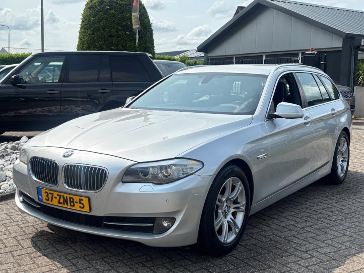 BMW 5-serie Touring - 528i High Executive 2013 NL Auto Trekhaak - AutoWereld.nl