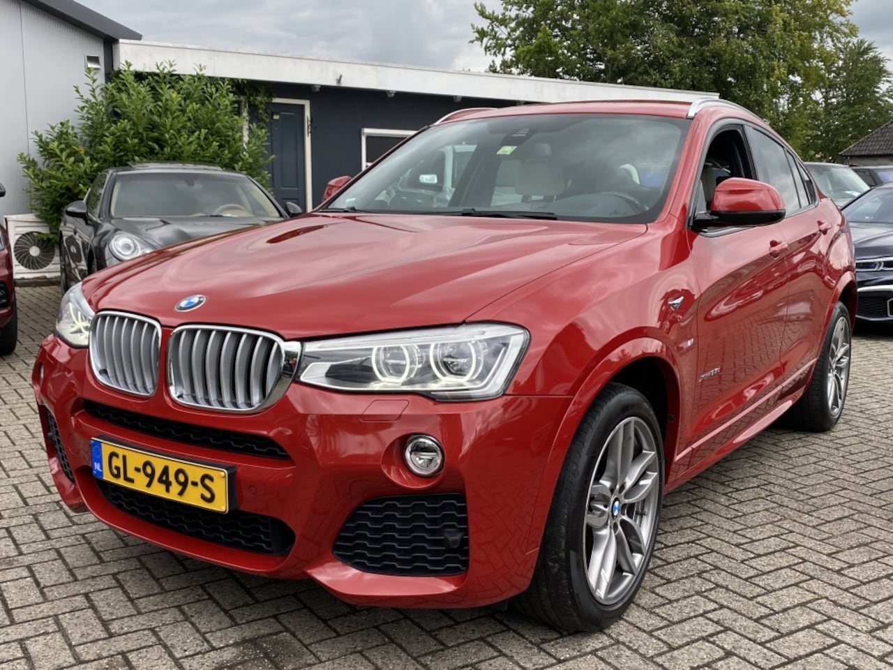BMW X4 - 3.5D X-Drive M-Pakket 2014 Rood Dealerauto - AutoWereld.nl