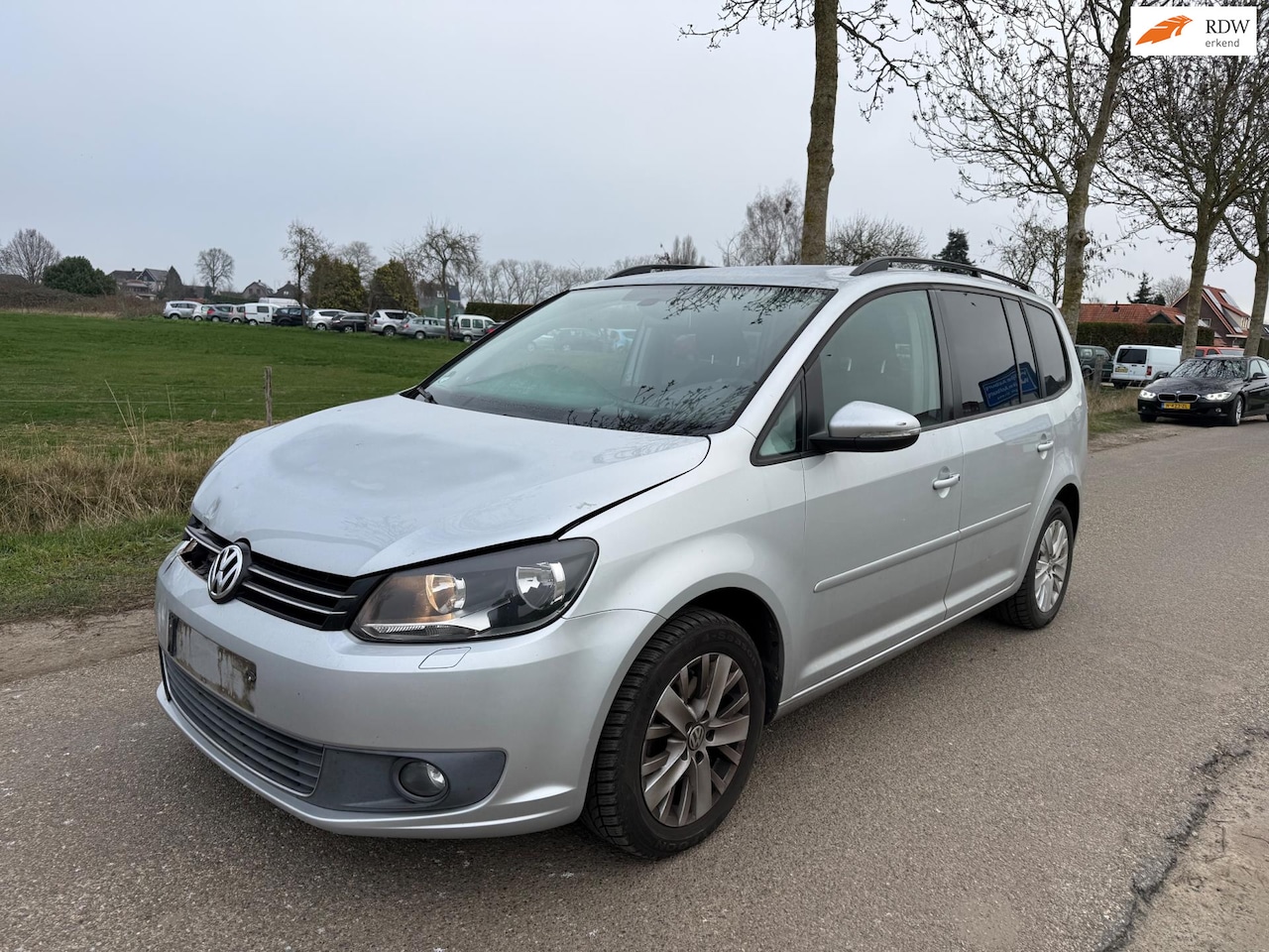 Volkswagen Touran - 1.2 TSI Highline BlueMotion 7p./ 130.00 Km!/ lichte schade - AutoWereld.nl