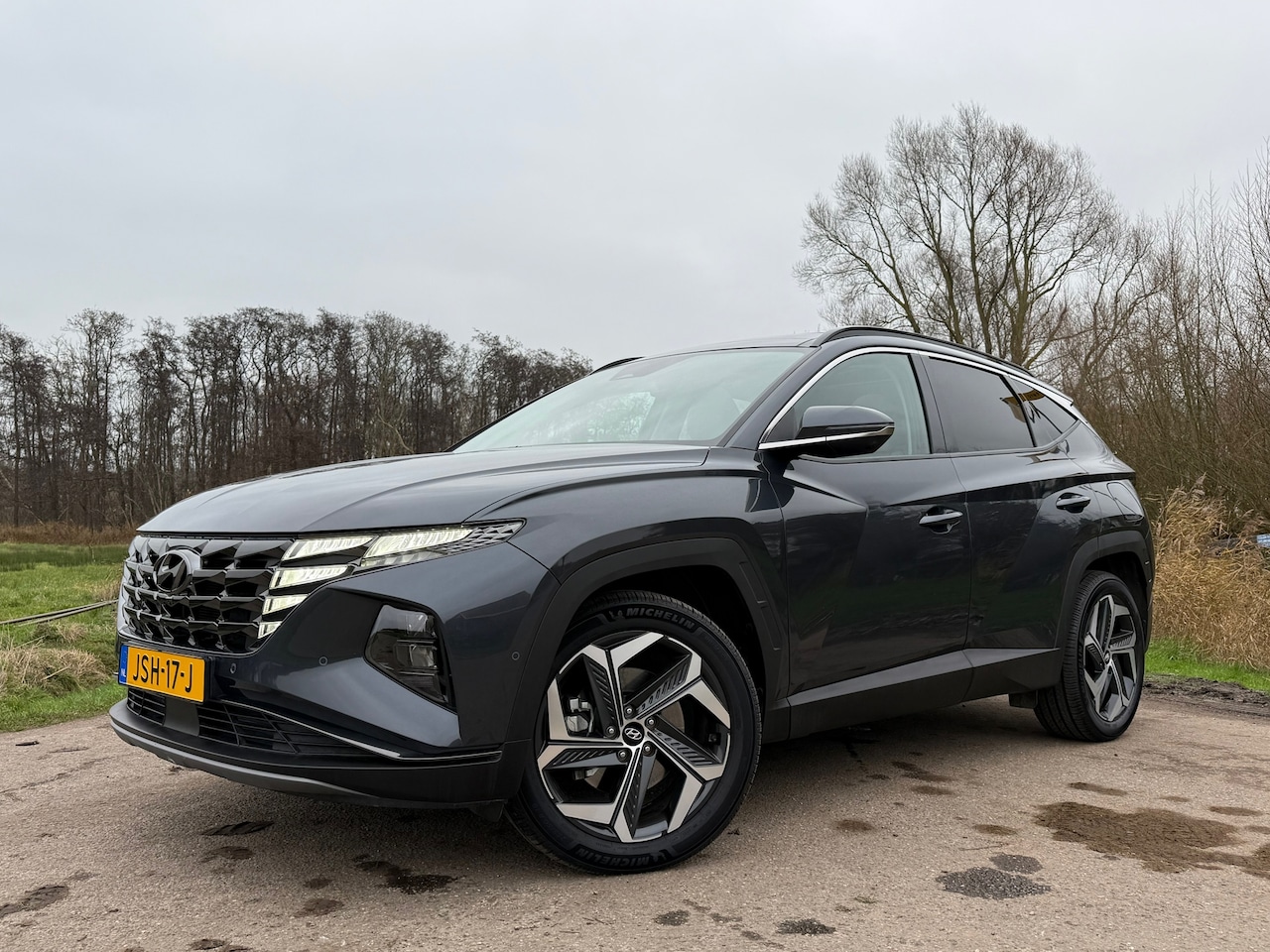 Hyundai Tucson - 1.6 T-GDI PHEV Premium 4WD Automaat / Panoramadak / Leder / 360 Camera / Apple Carplay-And - AutoWereld.nl