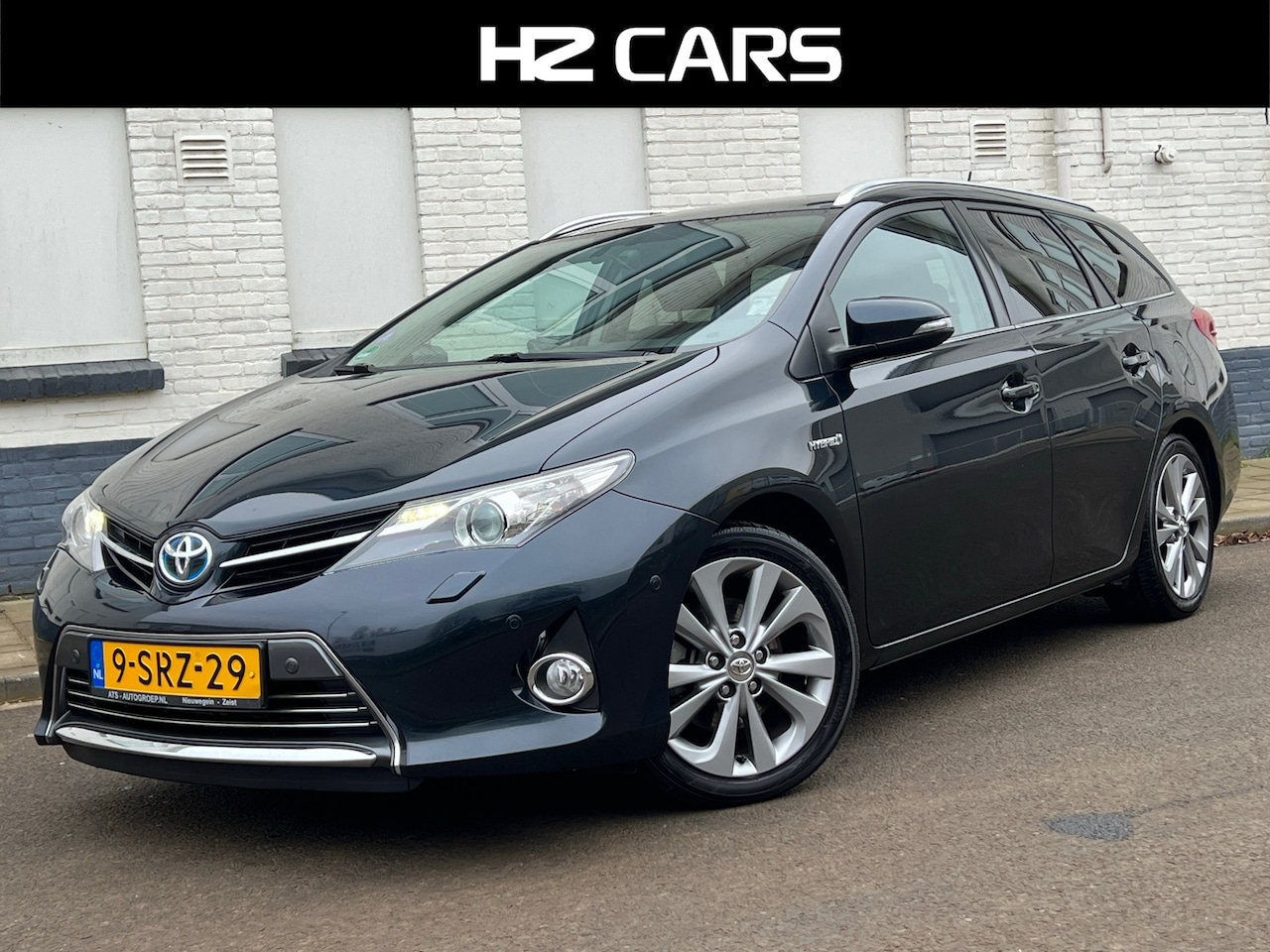 Toyota Auris Touring Sports - 1.8 Hybrid Lease Pro/Pano/Keyless/Camera/Leder - AutoWereld.nl