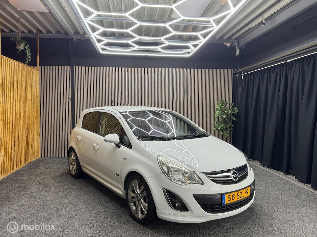 Opel Corsa - 1.4-16V Edition OPC Line | Navi | PDC | Cruise - AutoWereld.nl