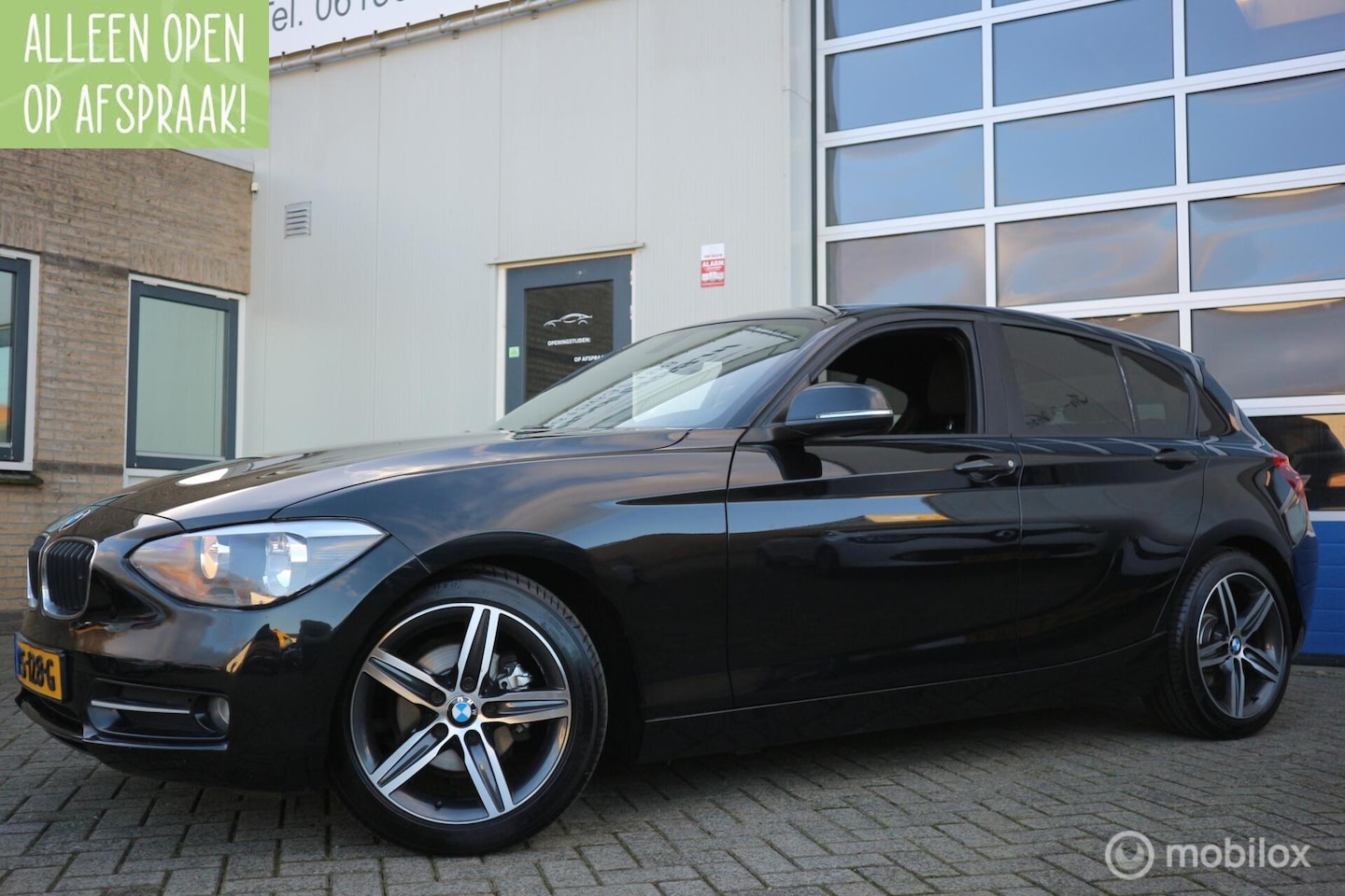 BMW 1-serie - 116i Sport AIRCO-ECC/NAVIGATIE/PDC/TREKHAAK/LMV - AutoWereld.nl
