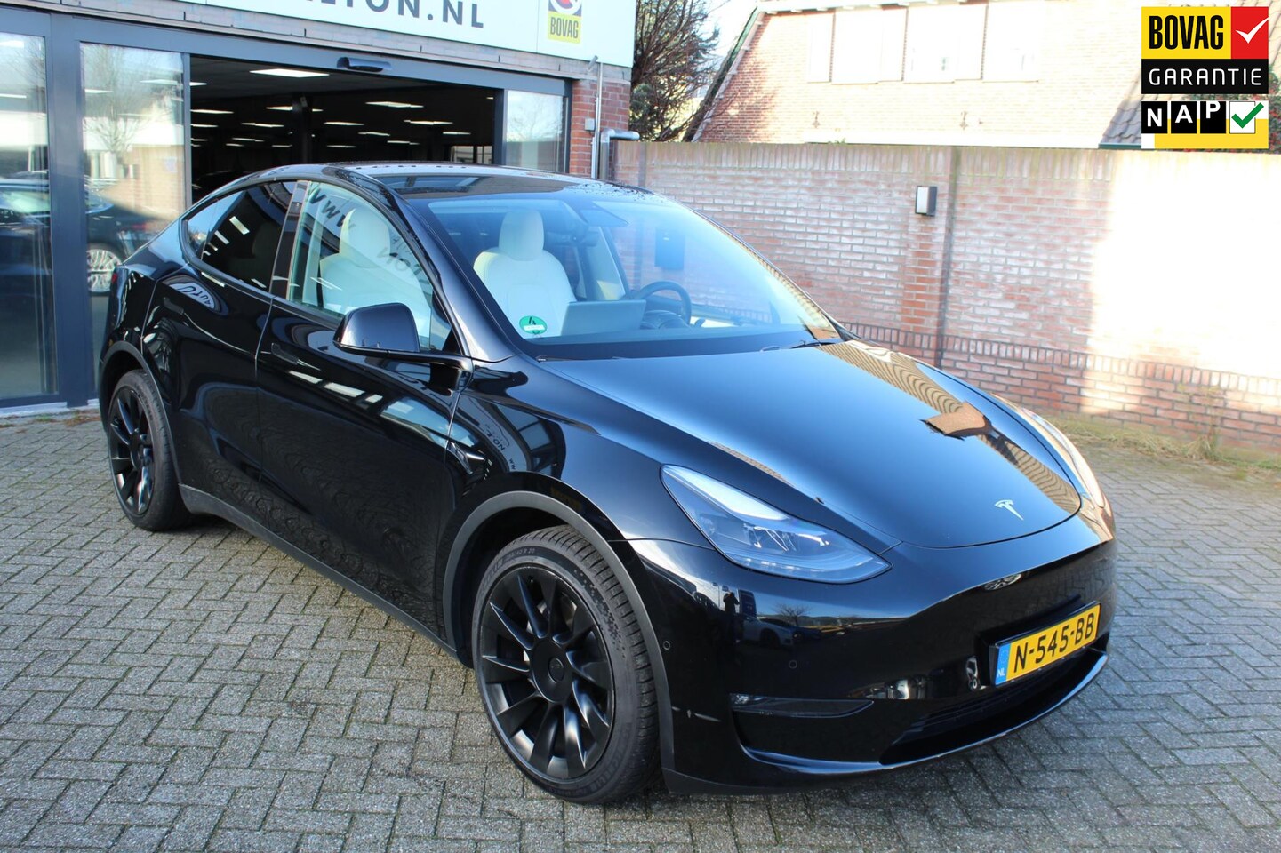 Tesla Model Y - Long Range AWD 75 kWh WIT LEER/21" - AutoWereld.nl