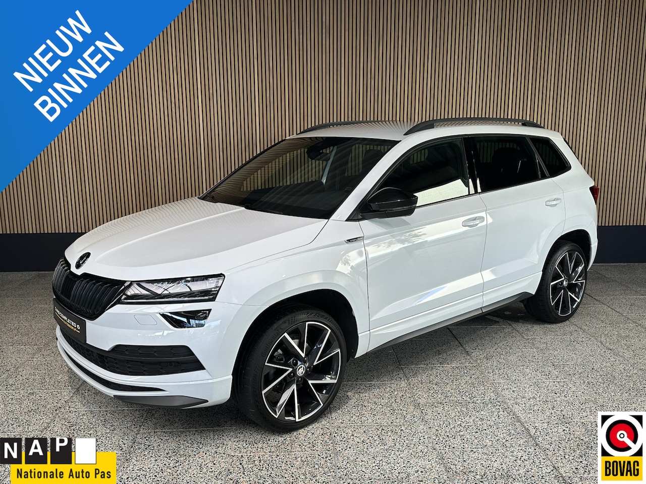 Skoda Karoq - 1.5 TSI Sportline Business NL auto | Trekhaak | Camera | Carplay - AutoWereld.nl