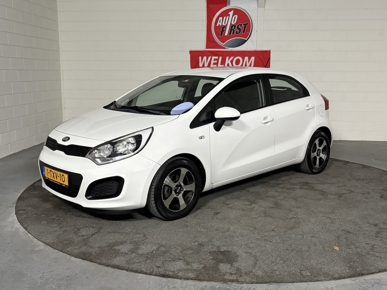 Kia Rio - 1.2 CVVT ComfortLine 1.2 CVVT ComfortLine, NL auto, Boekjes, Airco, Lichtmetaal, In hoogte verstelbare stoel, Z - AutoWereld.nl