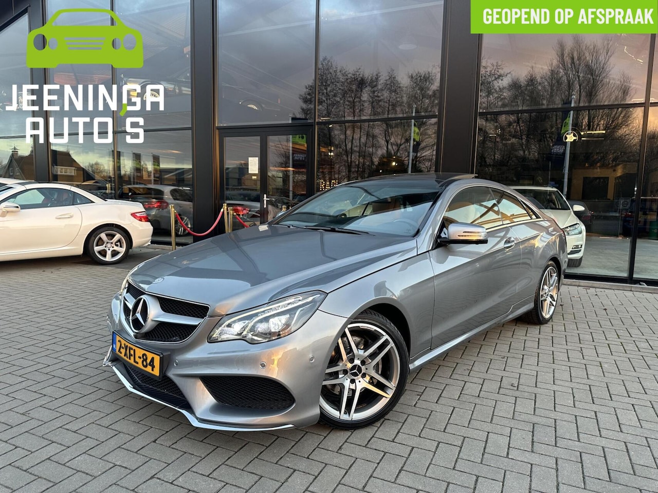 Mercedes-Benz E-klasse Coupé - 200 Prestige|AMG|Pano|360Camera|Leer|Navi - AutoWereld.nl