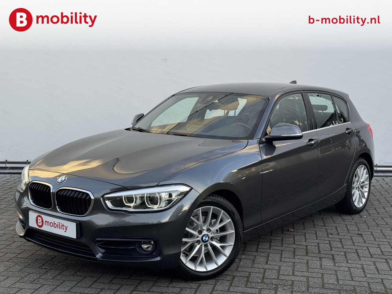 BMW 1-serie - 118i High Executive Sportline Automaat Apple CarPlay | Achteruitrijcamera | Hifi | Driving - AutoWereld.nl