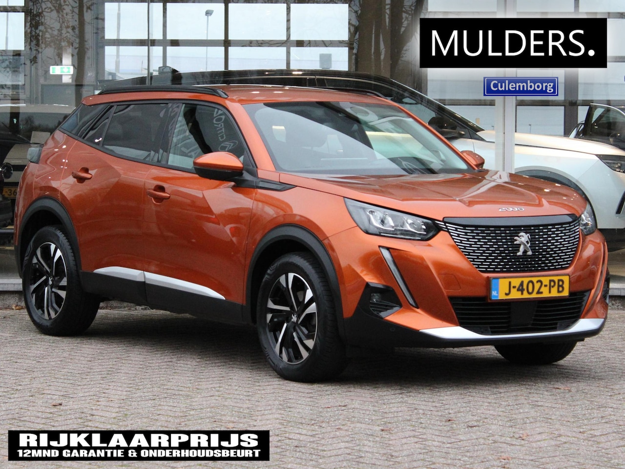 Peugeot 2008 - 1.2 PT Blue Lease Allure | Trekhaak / Camera / Climate - AutoWereld.nl