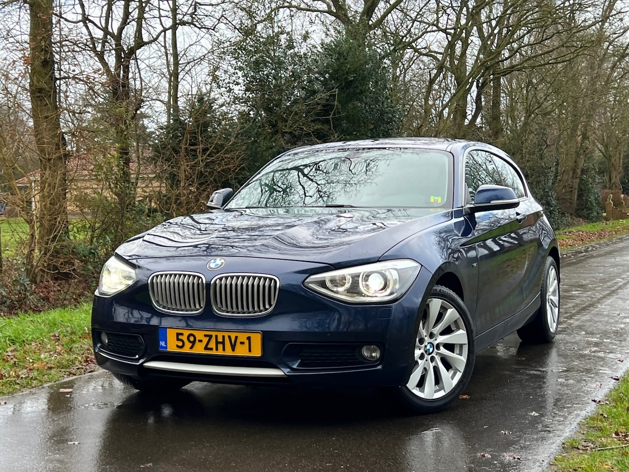 BMW 1-serie - 116i Upgrade Edition | Leder + Navi + Cruise + Airco Nu € 6.999,-!!! - AutoWereld.nl