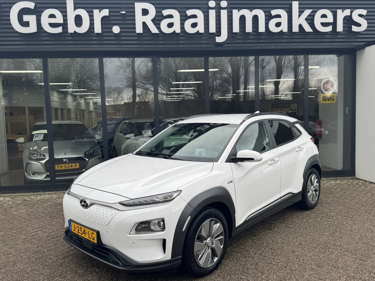Hyundai Kona Electric - EV Premium 64 kWh*Stoelverwarming*Navigatie*Leder* - AutoWereld.nl