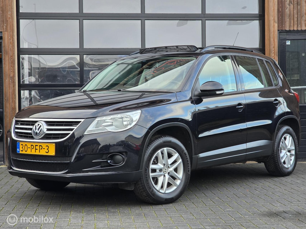 Volkswagen Tiguan - 1.4 TSI 122PK PANODAK CRUISE TREKHAAK CLIMA - AutoWereld.nl