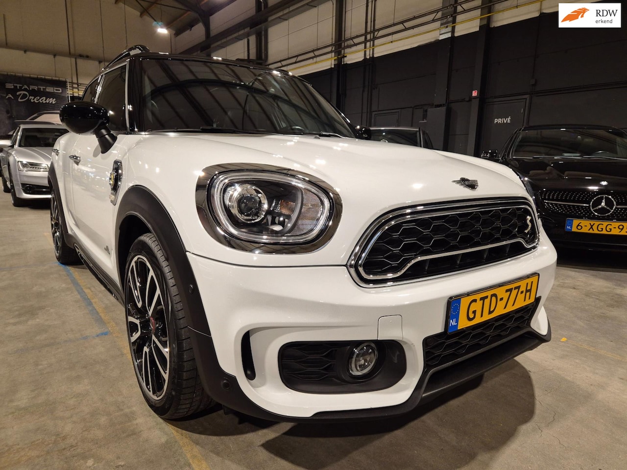 MINI Countryman - Mini 2.0 Cooper S E ALL4 Chili - JCW Pakket - Panoramadak - HuD - Leder - Adapt Cruise - P - AutoWereld.nl